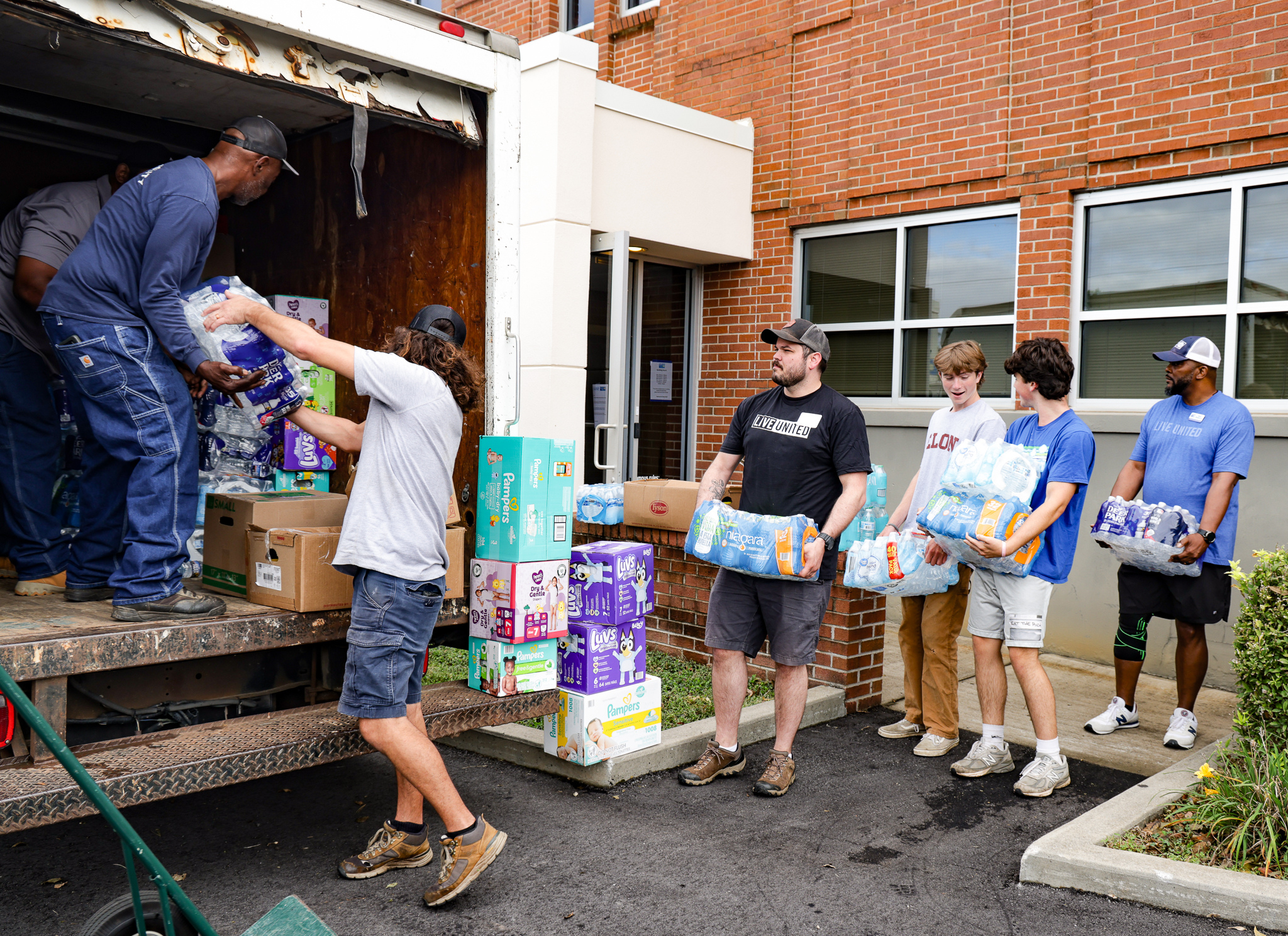 United Way staff loading water into truck