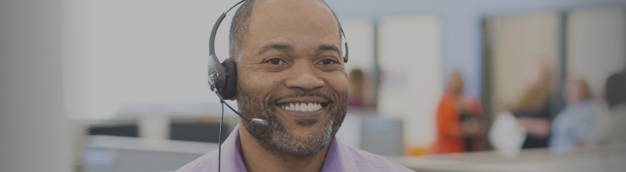 Person smiling with headset