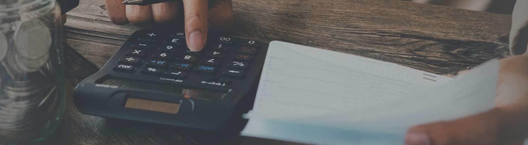 Close-up photo of someone using a calculator